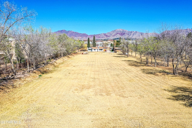 mountain view featuring a rural view