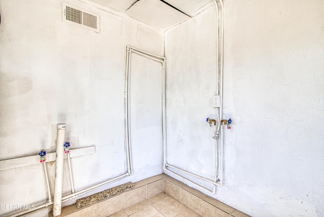 bathroom featuring visible vents and tile patterned flooring