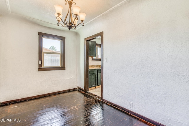 unfurnished room featuring light wood-style flooring and a textured wall