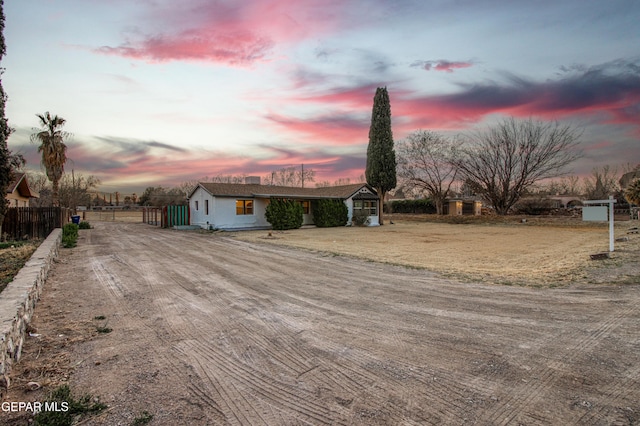 view of front of property featuring a gate and fence