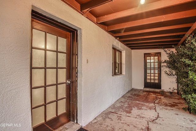 property entrance with stucco siding