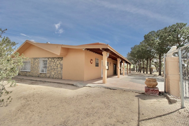 rear view of house with a patio