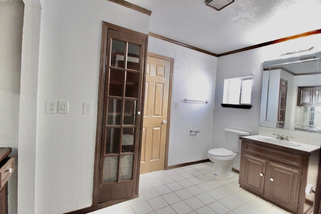 bathroom featuring toilet, crown molding, tile floors, a textured ceiling, and large vanity