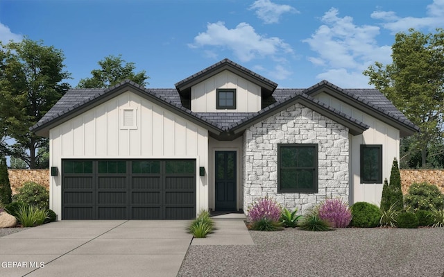 view of front of house with a tile roof, an attached garage, board and batten siding, stone siding, and driveway