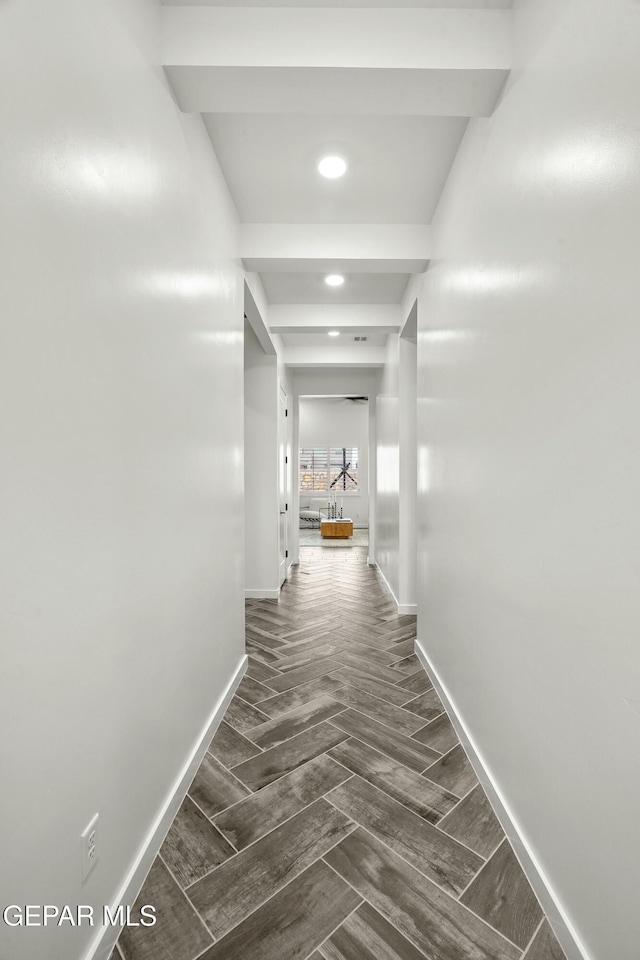 hallway with wood tiled floor, baseboards, and recessed lighting