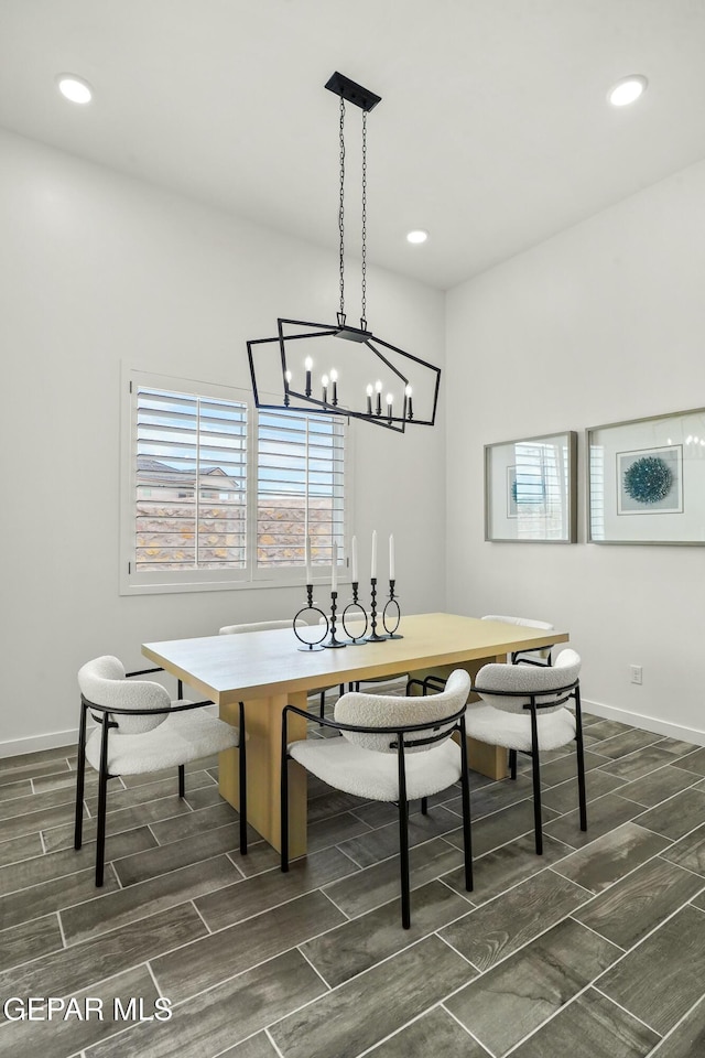 dining room featuring recessed lighting, baseboards, and wood finish floors