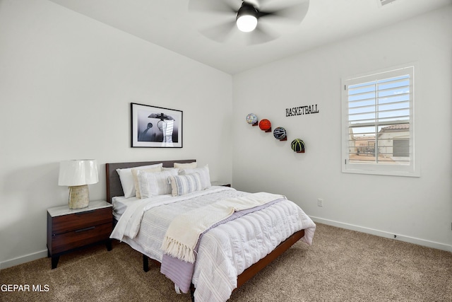 carpeted bedroom featuring baseboards and a ceiling fan