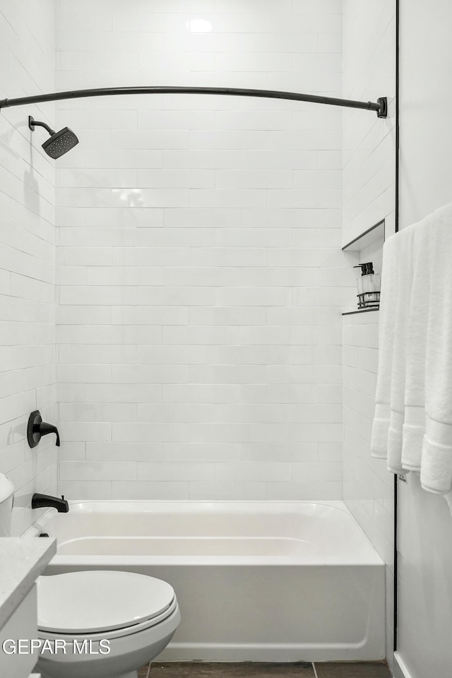 full bath with  shower combination, vanity, and toilet