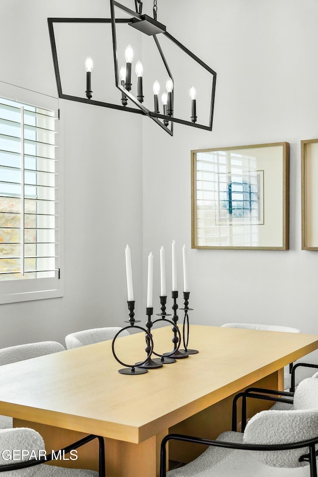 dining space featuring an inviting chandelier