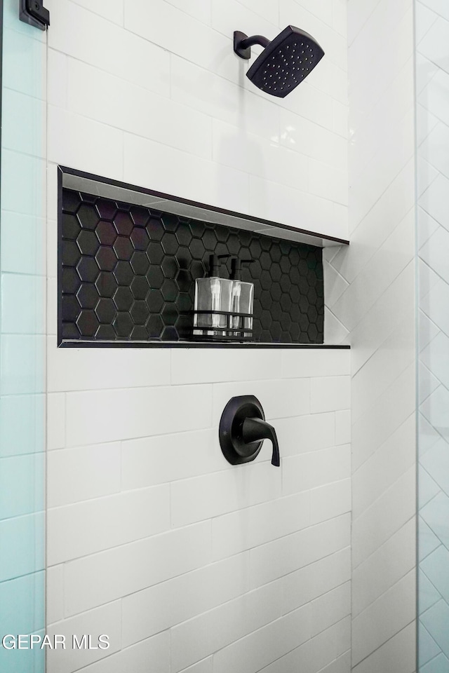 room details with a tile shower