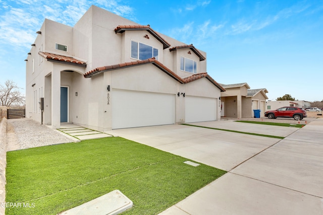 view of front of home featuring a front lawn and a garage