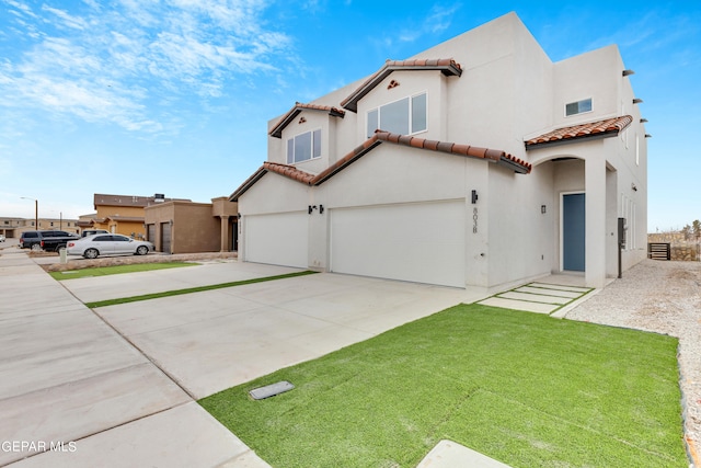 view of front facade featuring a front lawn and a garage