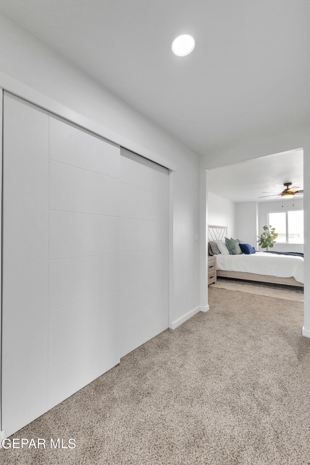 unfurnished bedroom with light colored carpet