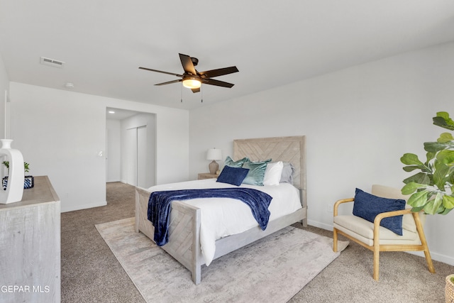 bedroom with ceiling fan and light colored carpet