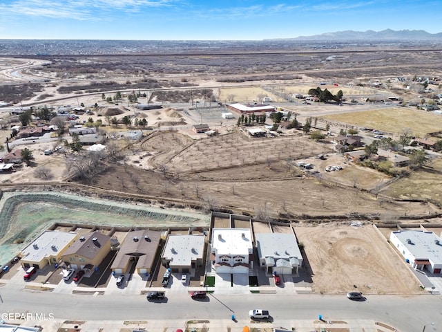 drone / aerial view featuring a mountain view