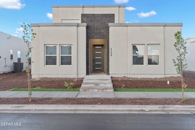 view of front facade featuring central AC