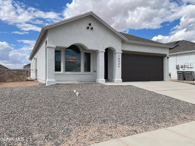 ranch-style house featuring a garage