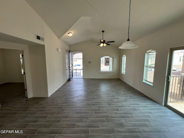 unfurnished living room with ceiling fan and lofted ceiling