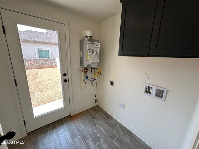 doorway featuring tankless water heater and hardwood / wood-style floors