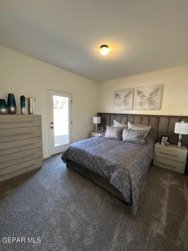 bedroom featuring dark colored carpet