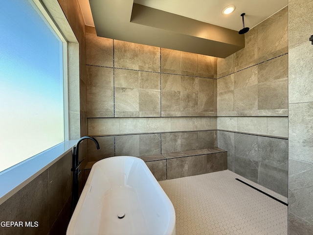 320 Roper Ln, Clint, TX 79836 - full bath featuring a freestanding bath, tile walls, and tiled shower