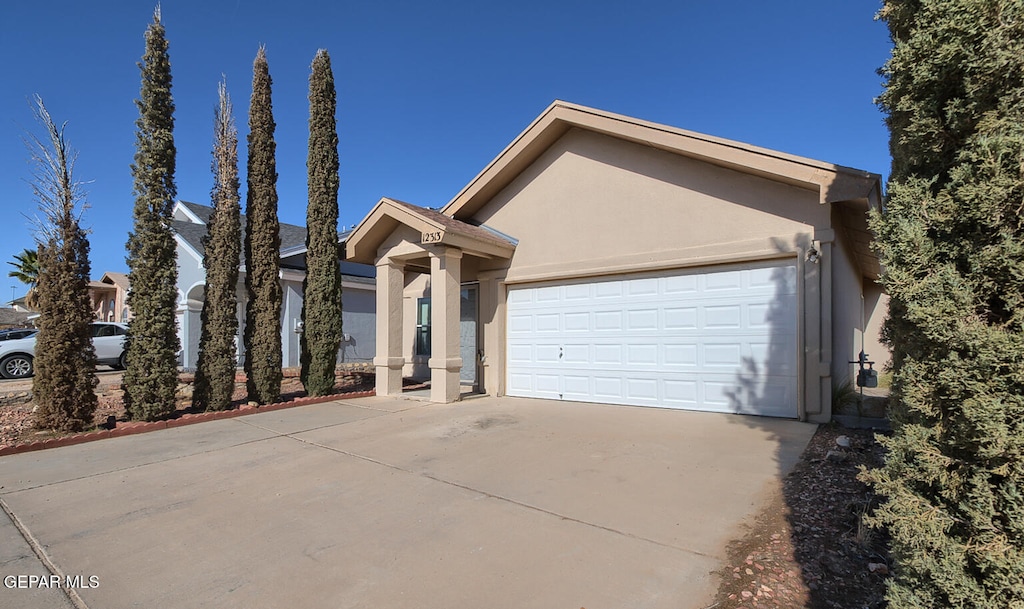 ranch-style house featuring a garage