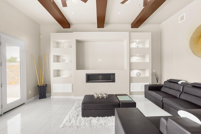 living room with light tile floors, ceiling fan, a wealth of natural light, and built in shelves