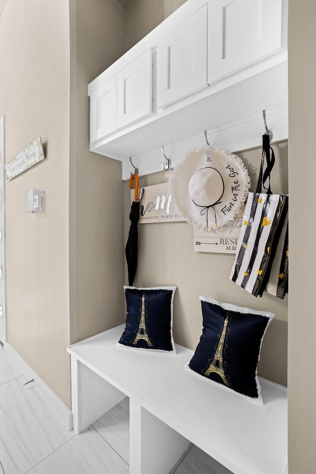 mudroom with light tile floors