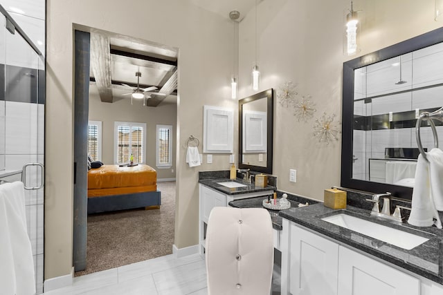 bathroom with ceiling fan, beamed ceiling, tile floors, a towering ceiling, and dual bowl vanity