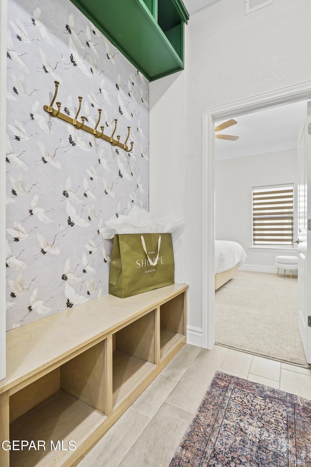 mudroom featuring carpet and ceiling fan