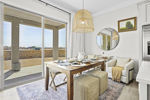 dining area with light hardwood / wood-style floors