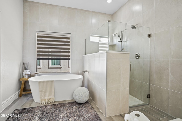 bathroom featuring plus walk in shower, radiator heating unit, and tile walls