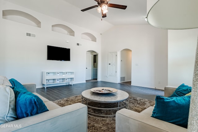 living room featuring high vaulted ceiling, dark wood-type flooring, and ceiling fan