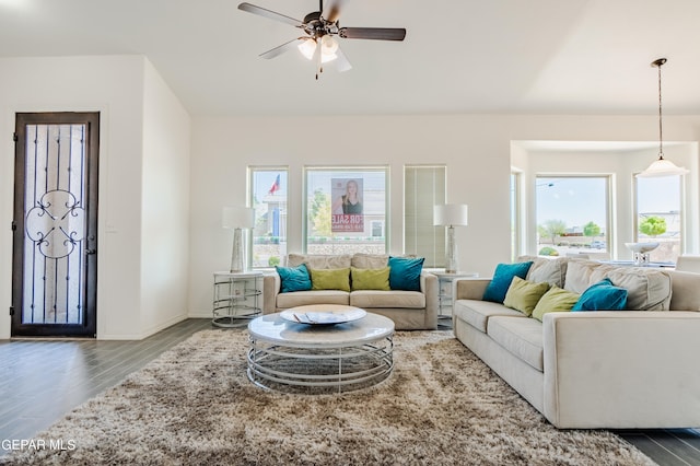 living room featuring wood-type flooring, plenty of natural light, and ceiling fan