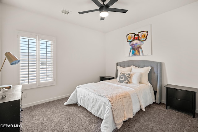 bedroom featuring dark colored carpet and ceiling fan