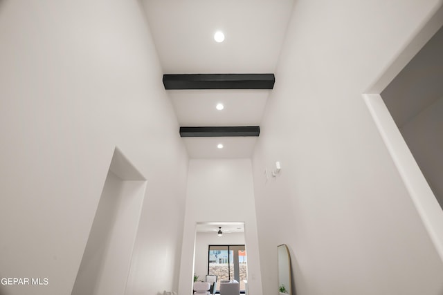 interior space featuring beamed ceiling