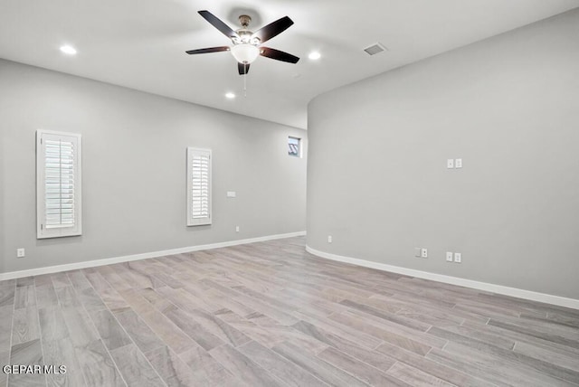 spare room with ceiling fan and light hardwood / wood-style flooring