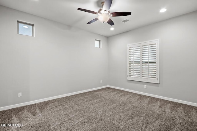 spare room featuring carpet flooring and plenty of natural light