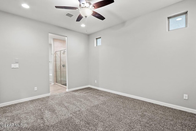 spare room with carpet and ceiling fan