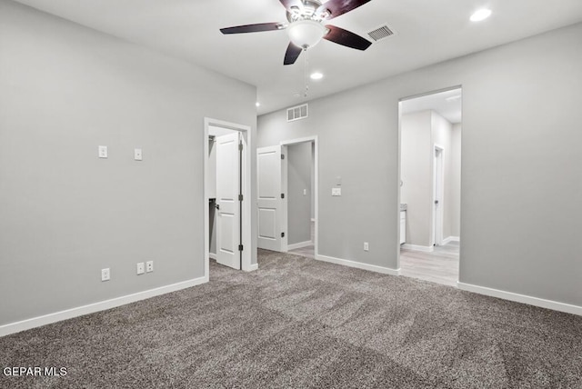 unfurnished bedroom featuring ceiling fan and carpet floors