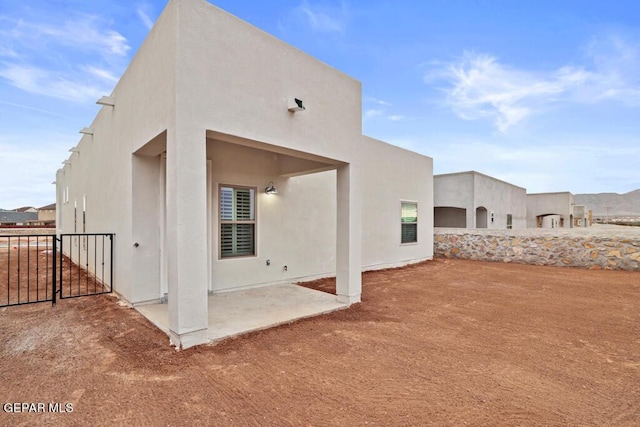 back of house featuring a patio area