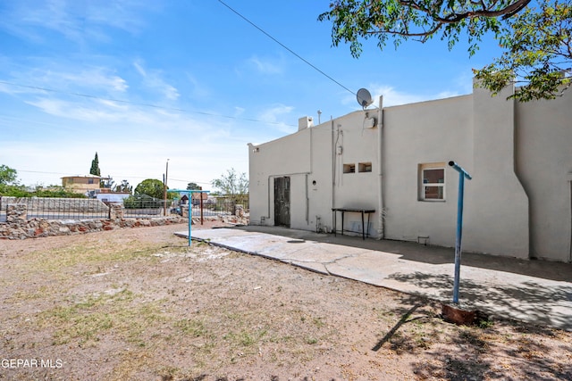 rear view of house featuring a patio