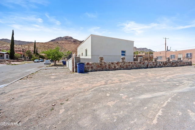 view of side of property with a mountain view