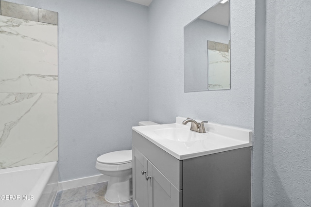 bathroom featuring toilet, tile floors, and vanity with extensive cabinet space