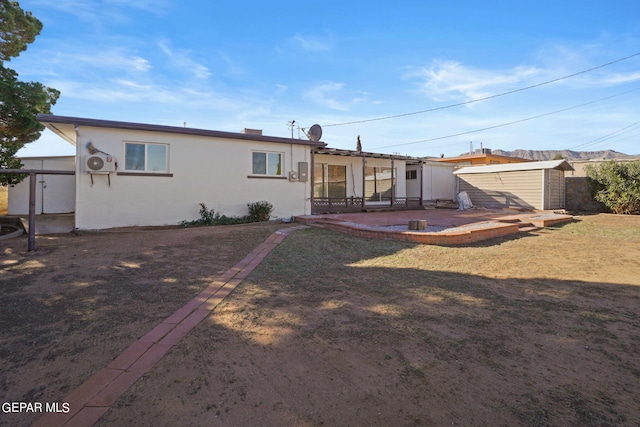 back of property featuring a patio