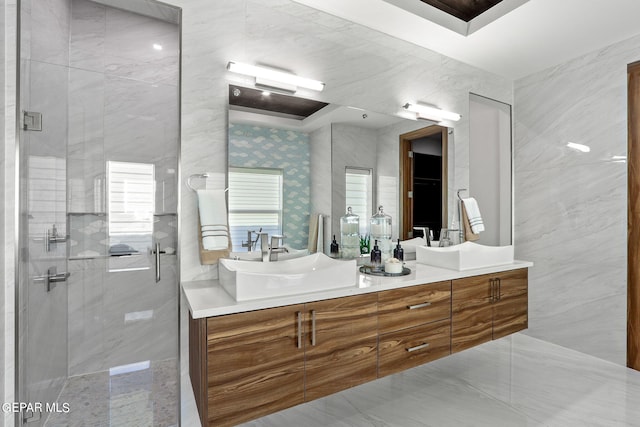 bathroom featuring dual vanity, tile walls, tile floors, and an enclosed shower