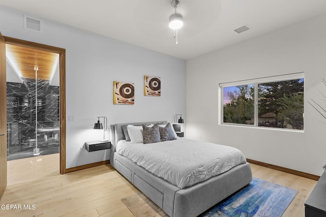 bedroom featuring light hardwood / wood-style flooring and ceiling fan