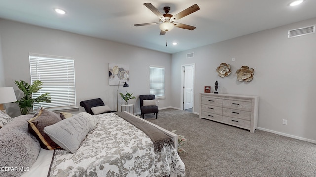 bedroom with multiple windows, carpet, and ceiling fan
