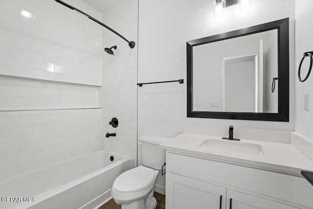 full bathroom featuring vanity, toilet, and tiled shower / bath combo