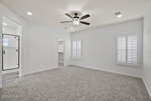 spare room with ceiling fan and carpet floors